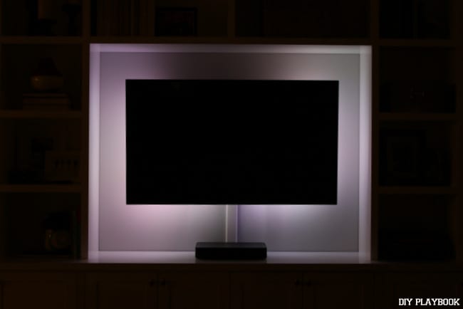 LED Lights behind the TV can create drama - don't you love this purple lighting? | DIY Playbook