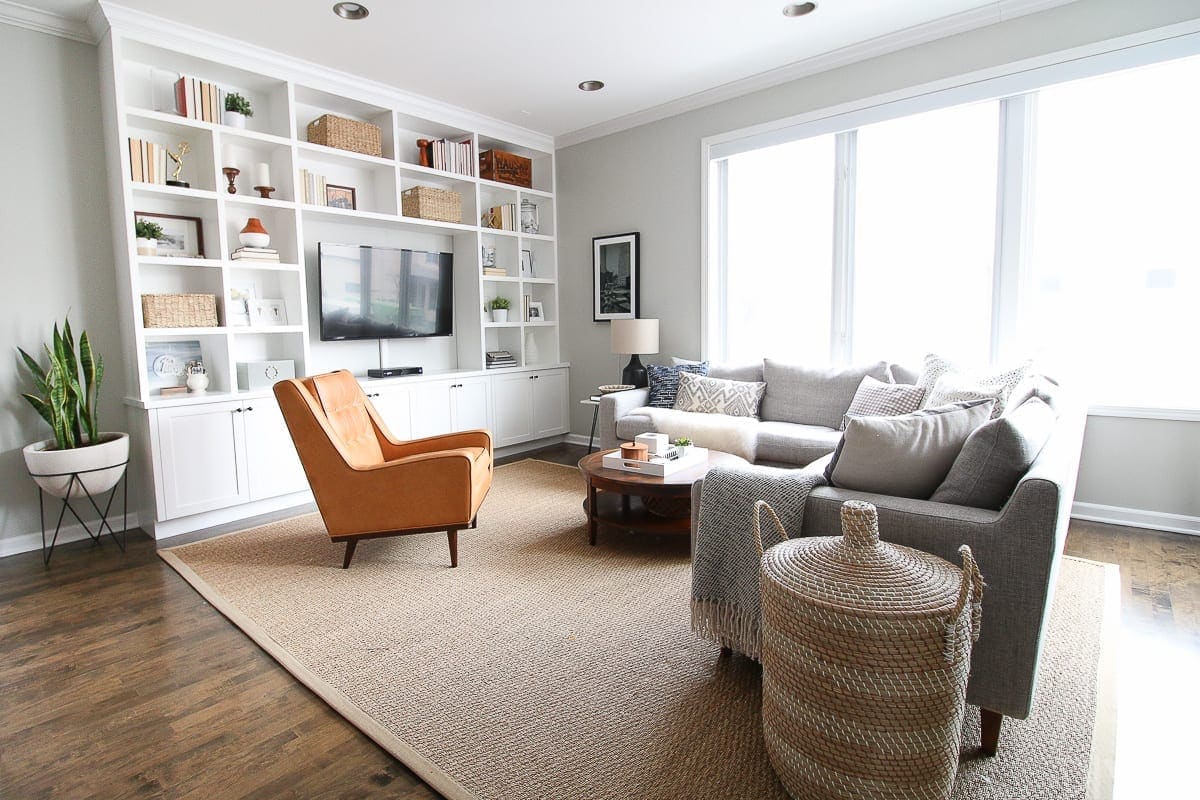 Open layout family room space with built-in shelves. 