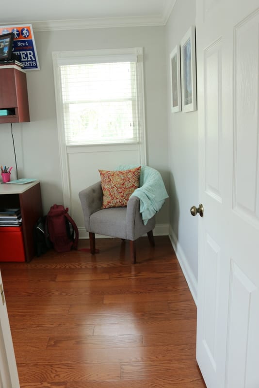 The dark floors in this office space pair well with the light gray wall color. 