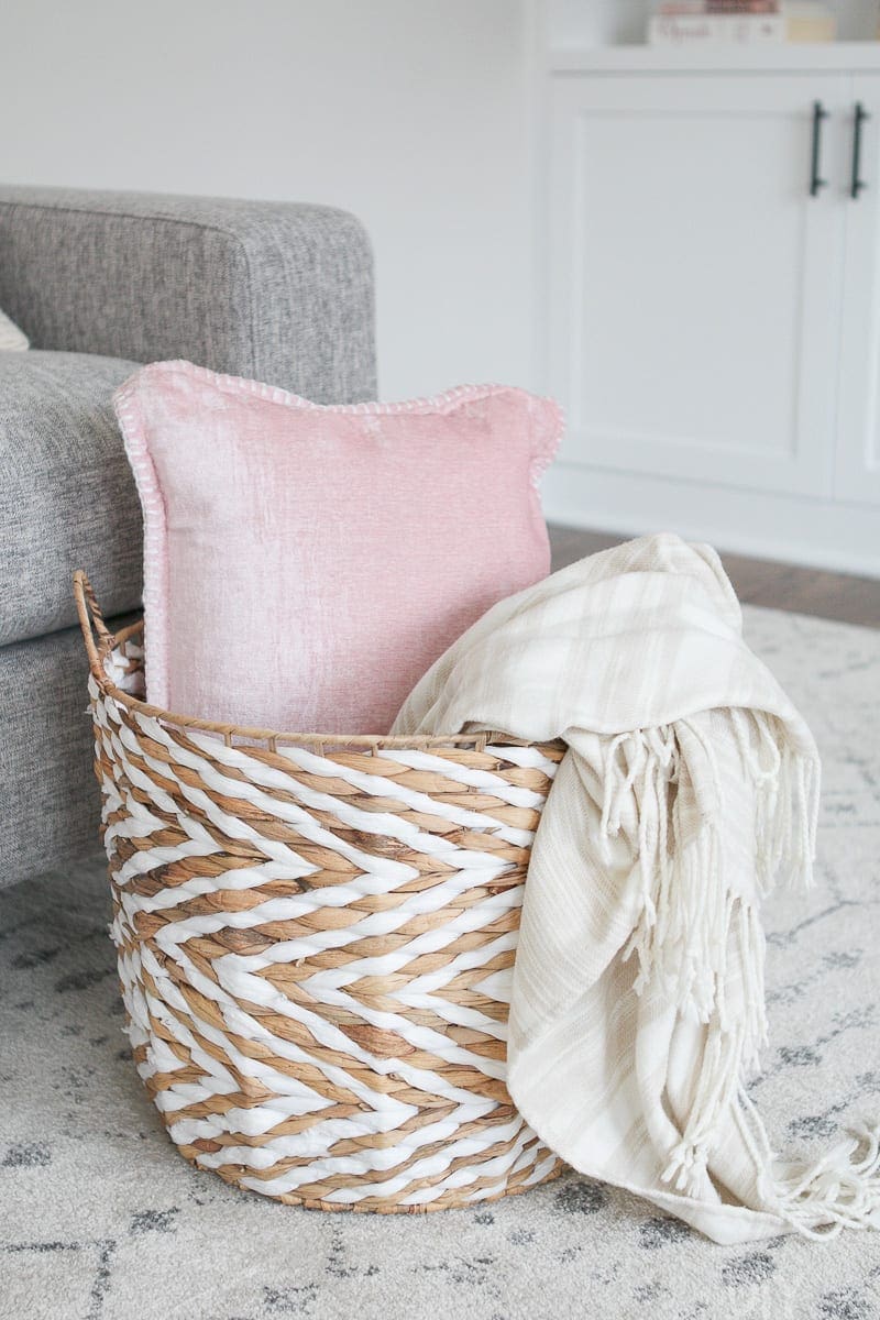 corralling couch clutter with a basket