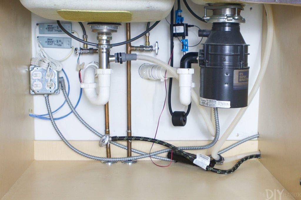 How to replace a garbage disposal when it's leaking