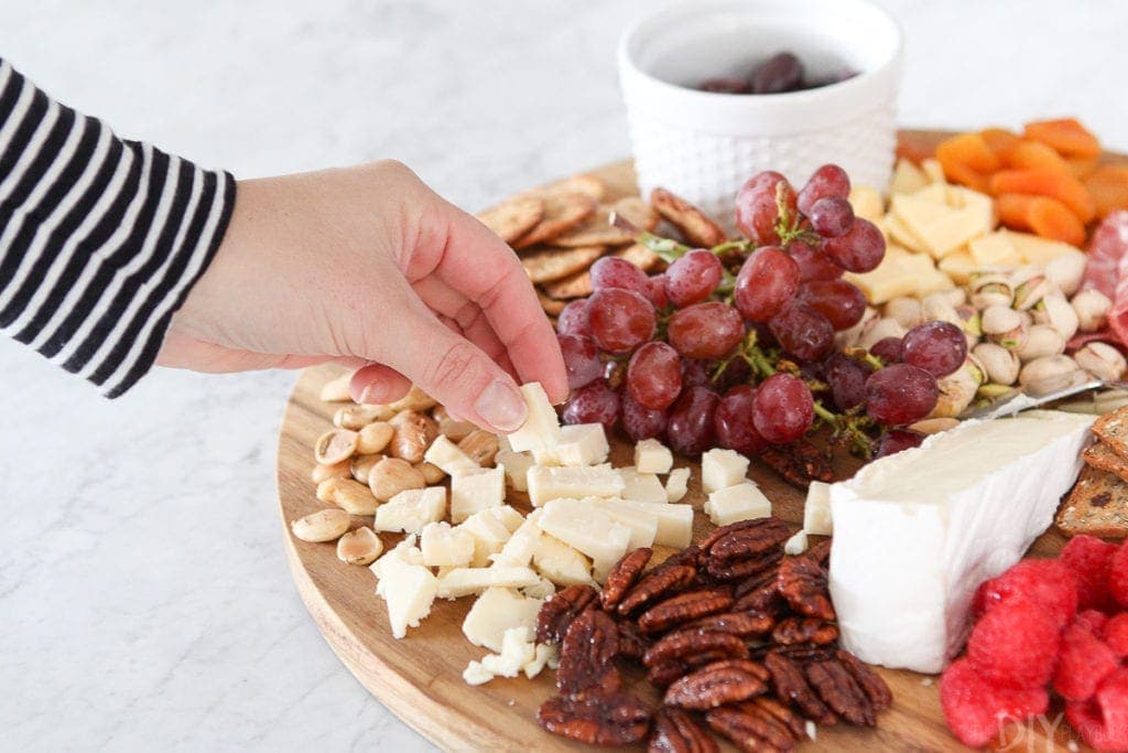 Eating cheese from a simple charcuterie board