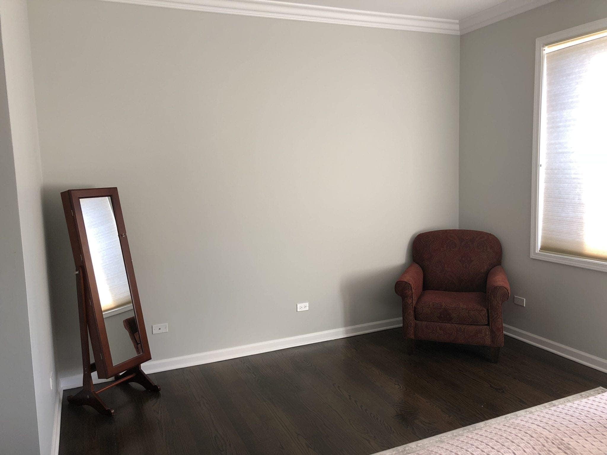 Before photos of a blank wall in a bedroom