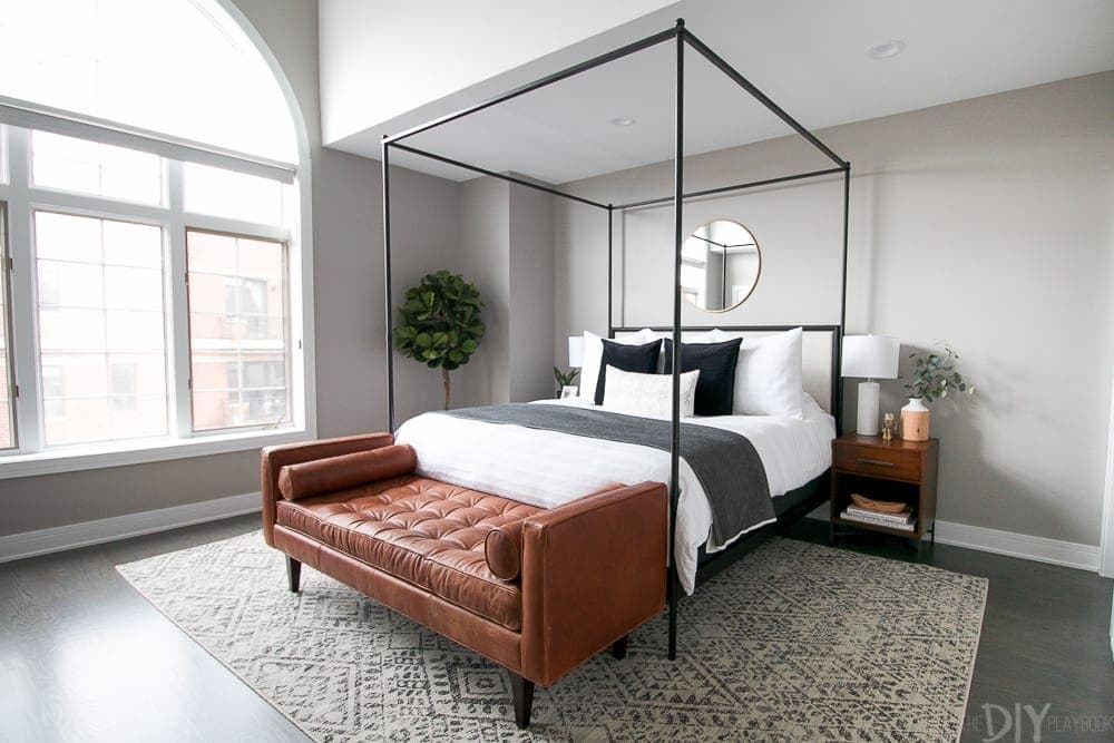 This contemporary master bedroom looks great with a tribal patterned area rug from Lulu & Georgia. 