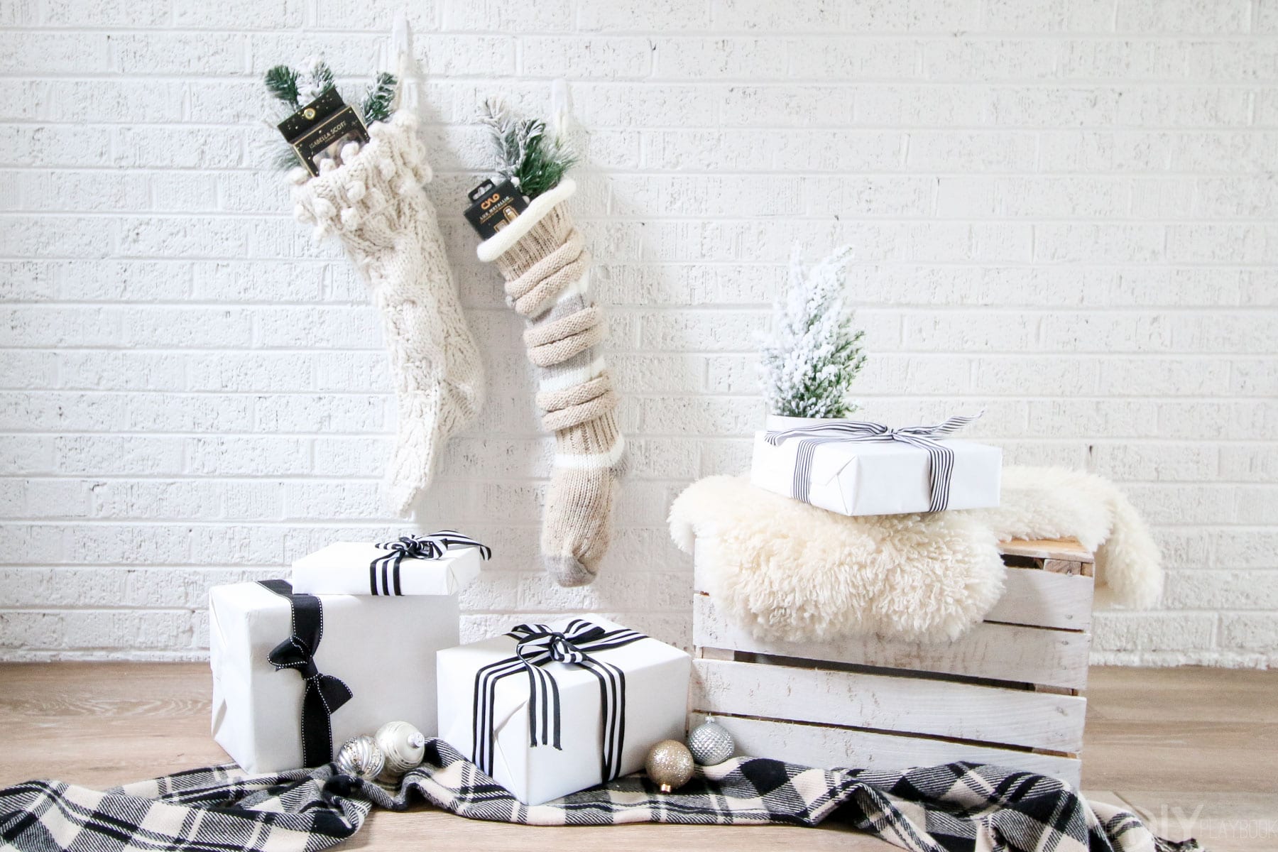 This christmas scene has all the essentials; stocking stuffers, presents, and a warm winter blanket. 