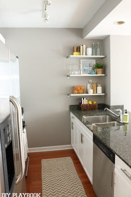 Maggie kitchen after - don't you love how the white and gray paint has totally transformed the space? And how gorgeous are those open shelves? 