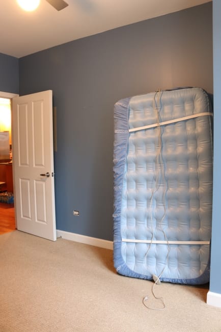 This was the bedroom before we got to redecorate! Again the dark colored wall has got to go.