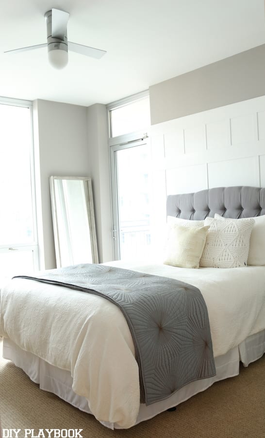 Here's the new bedroom with the board and batten wall, neutral walls and crisp white bedding. 