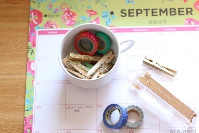 A desktop calendar, tape and other office supplies help college students stay organized. 