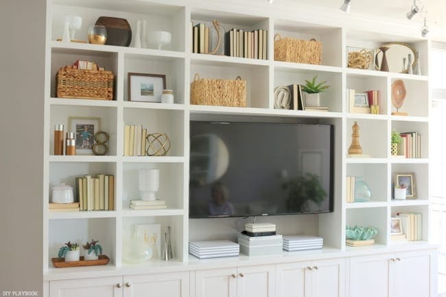 Built-in bookshelf and entertainment center with TV.