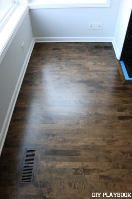 With the scratches removed, the new stained hardwood floors look gorgeous!