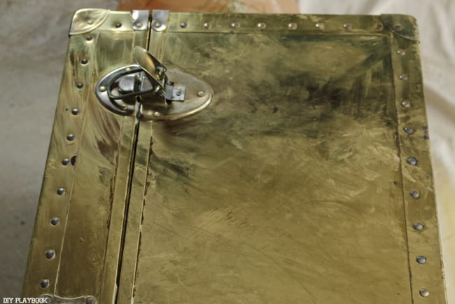 Refinishing this brass steamer trunk meant using lots of Brasso! Here's the trunk with a good coating. 