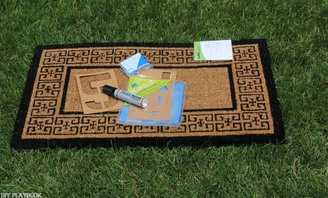 All you need for this project is a plain doormat, a permanent marker and some stencils