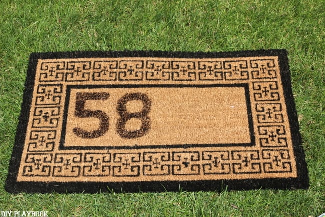 This personalized doormat is half finished, just a few more numbers