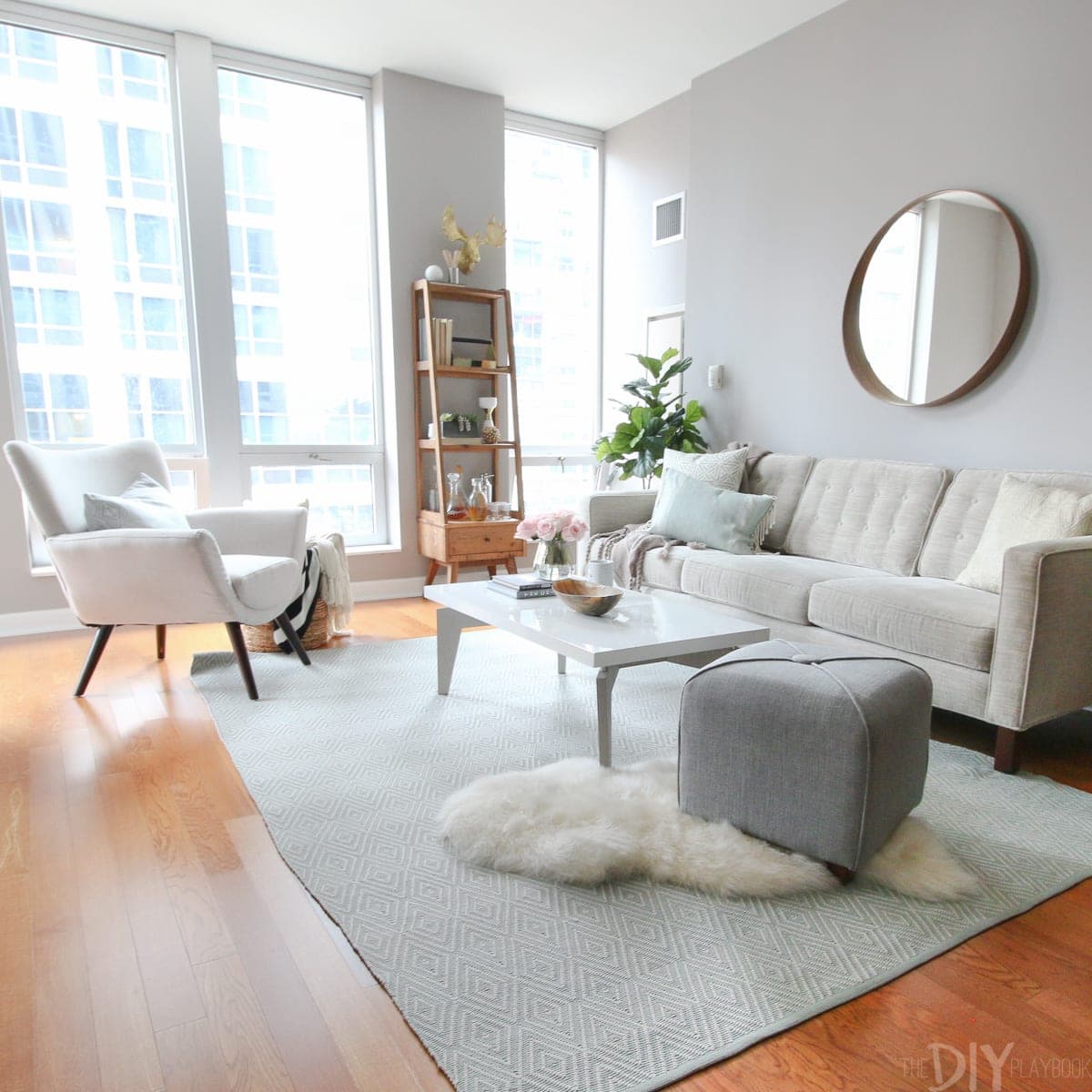 The large windows in this living room add a lot of light to the space. 