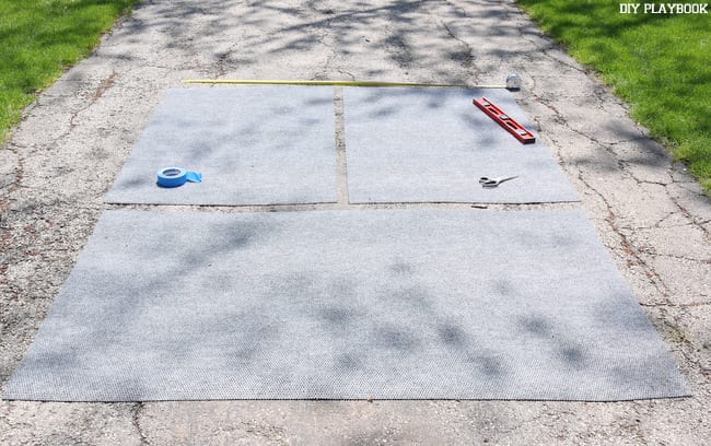 The outdoor rug, cut into three smaller pieces and ready for alterations. Next we tape them up and then apply the spray paint!