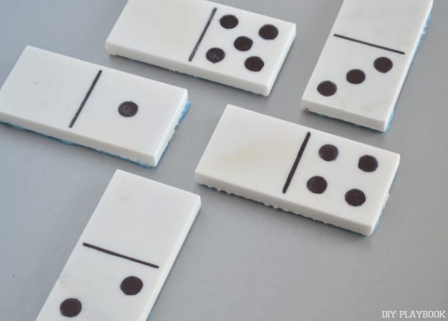 Once domino playing tiles are assembled, lay them out. 