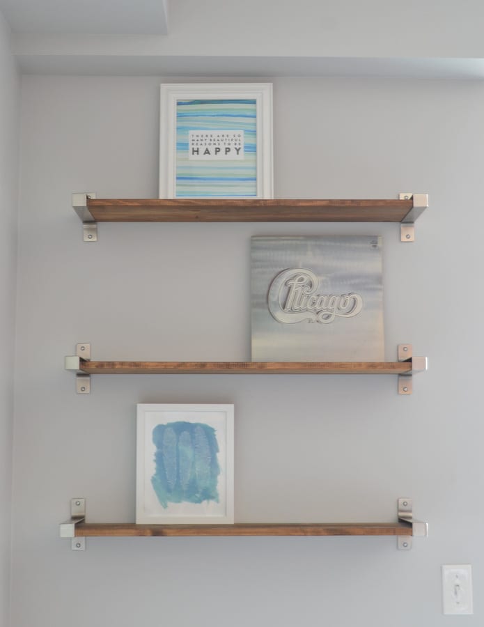 Layer shelves with frames in the background. 