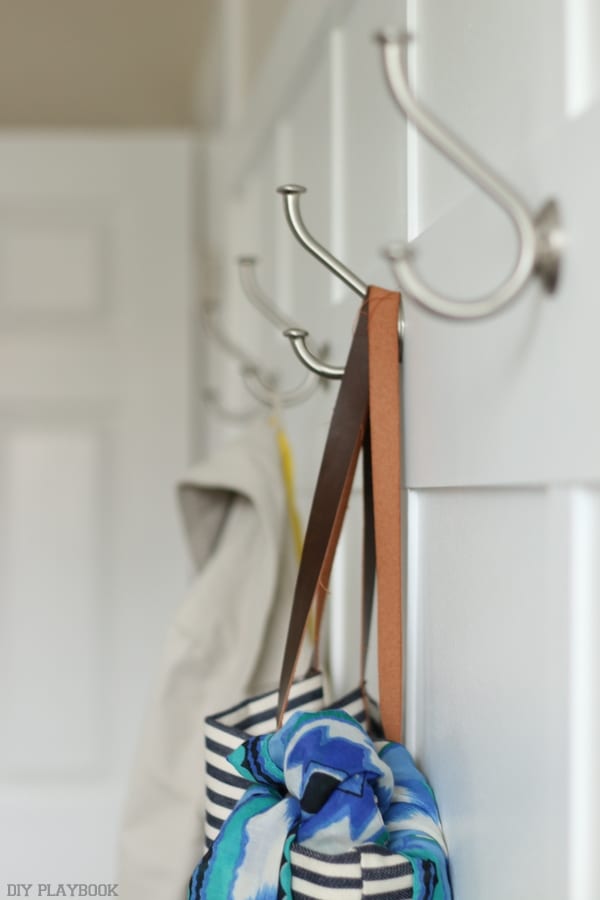 Hooks on this board and batten wall are great for storage. 