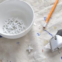 Use the right tile tools when installing new kitchen backsplash.