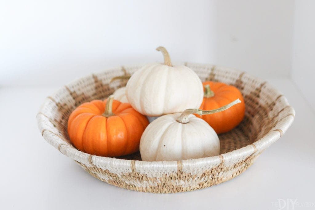 A basket full of mini pumpkins