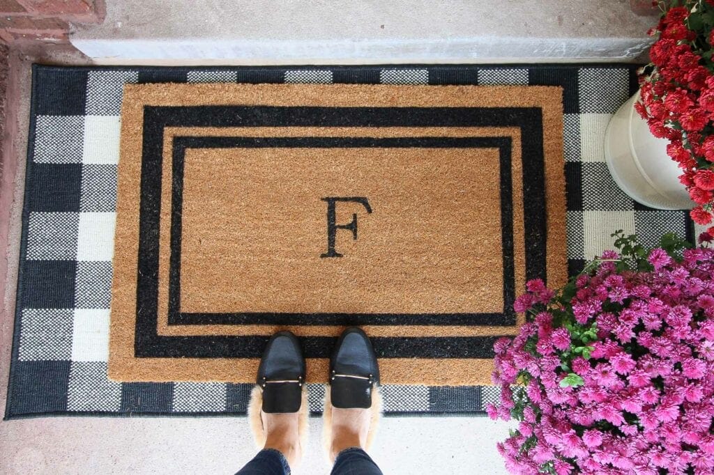 Buffalo check doormat with layered monogrammed rug