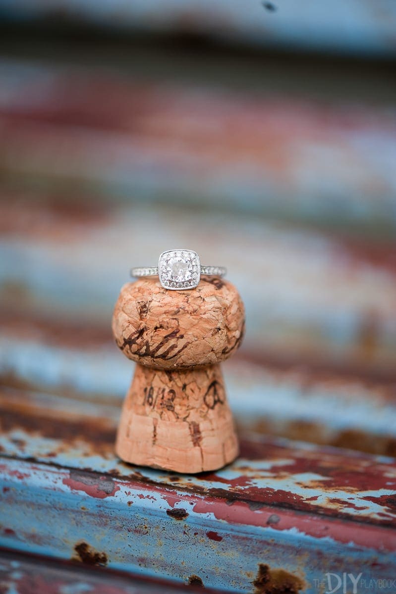 An engagement ring on a champagne cork