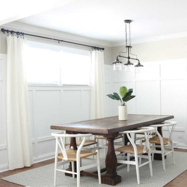 Dining Room with light walls and board and batten reveal. 