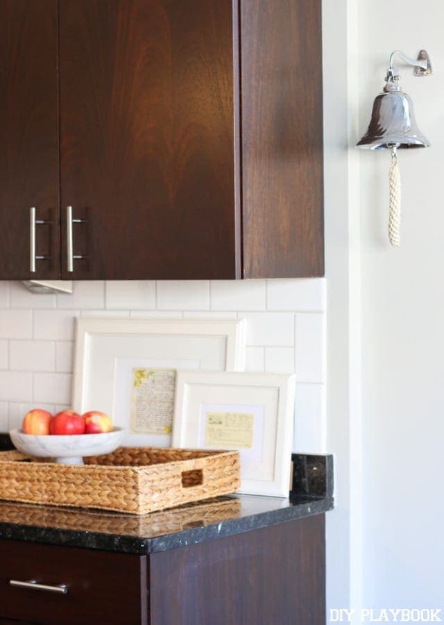 This dinner bell in the kitchen area is a fun, farmhouse decor element. 