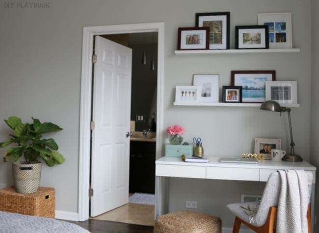 Bedroom with small workstation in the corner. 