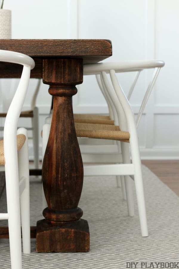 Details of the dining room table with chairs.