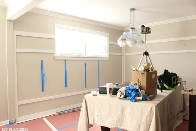 Measuring the dining room walls for the board and batten. 