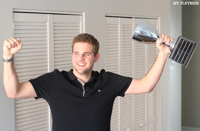 finn and his fantasy football trophy is a prized possession