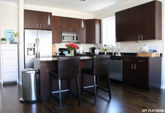 We had a white subway tile backsplash installed in the kitchen of our condo and I'm in love with the look!  | DiY Playbook